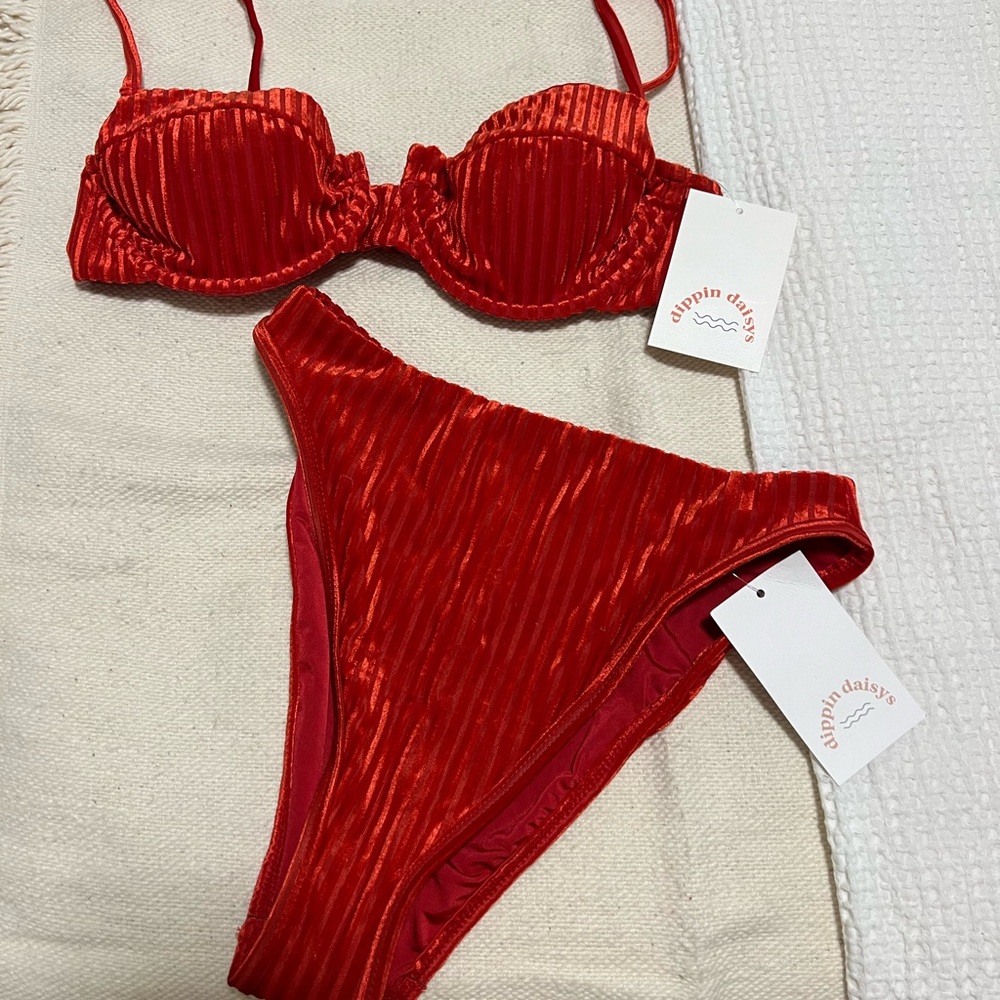 Selling this Dippin Daisys bikini top and bottom (too M, bottom S)